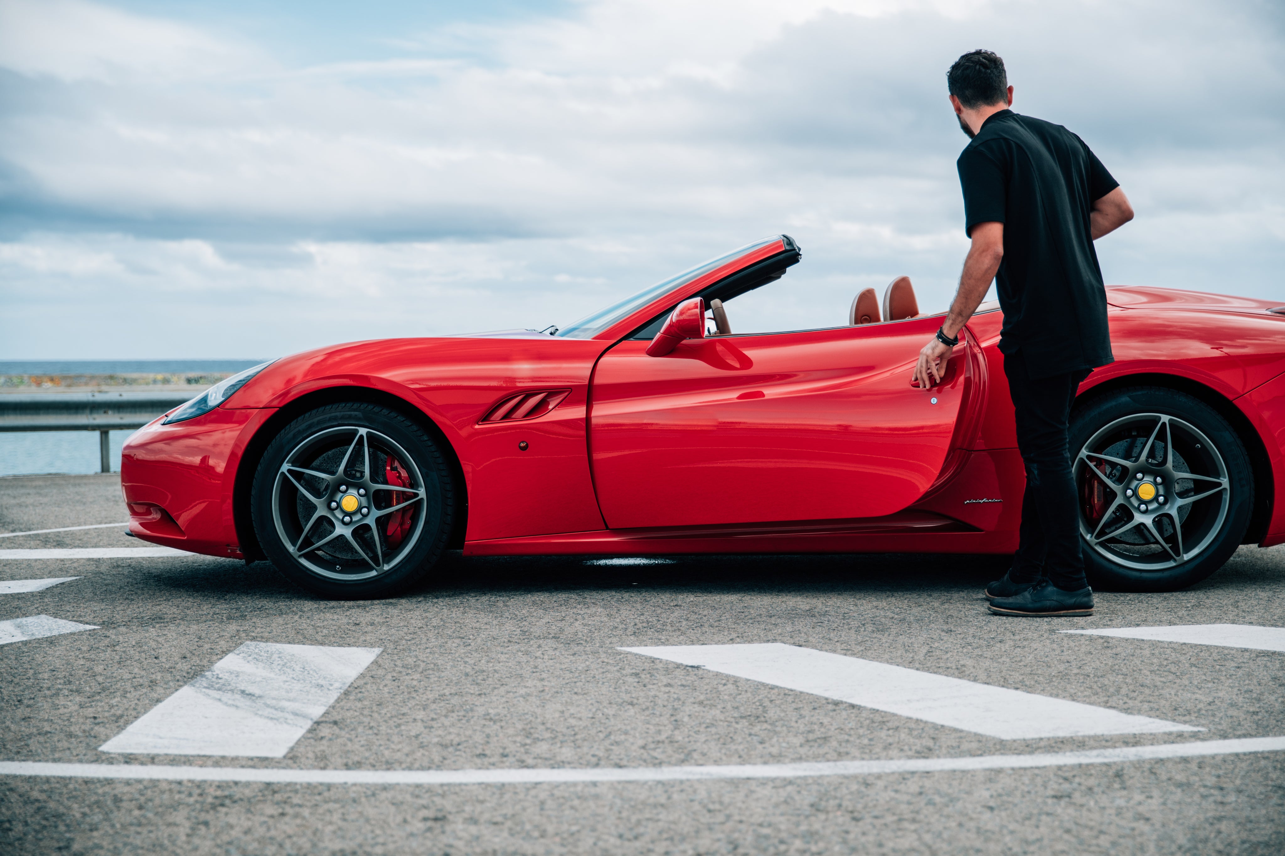 files/man-getting-into-red-sports-car.jpg